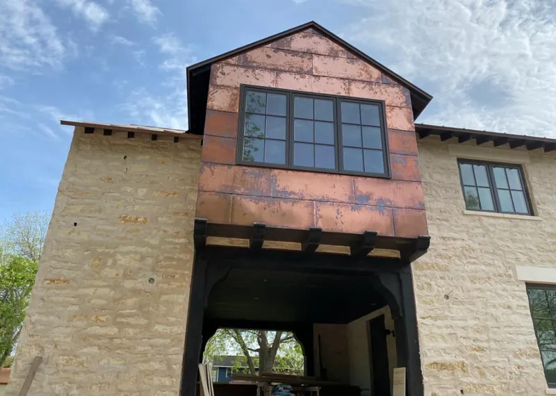 Copper metal panel facade on a stone building for Metal Roof Coating in Roseville